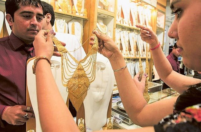 Gold slips from record highs but UAE buyers hope for bigger price drop